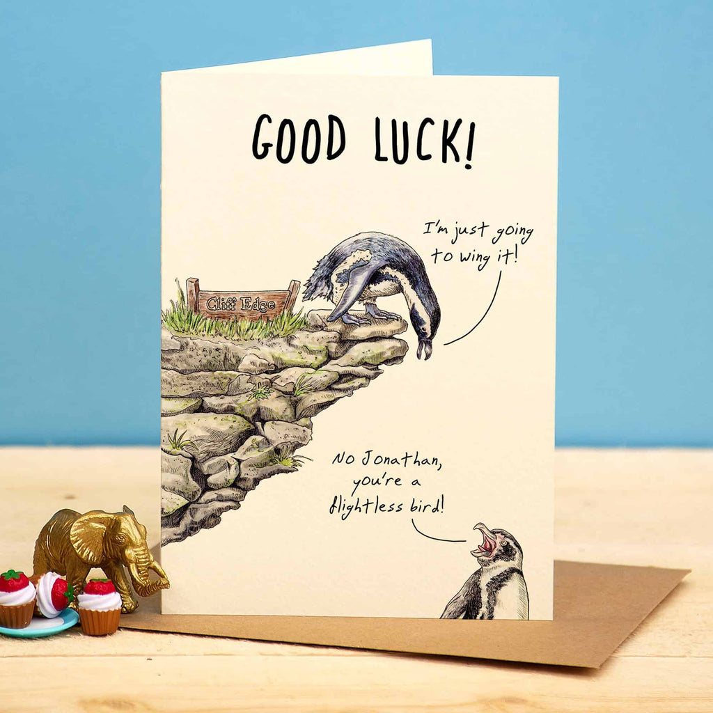 Greeting card with animal illustration and 'Good Luck!' text on a blue background