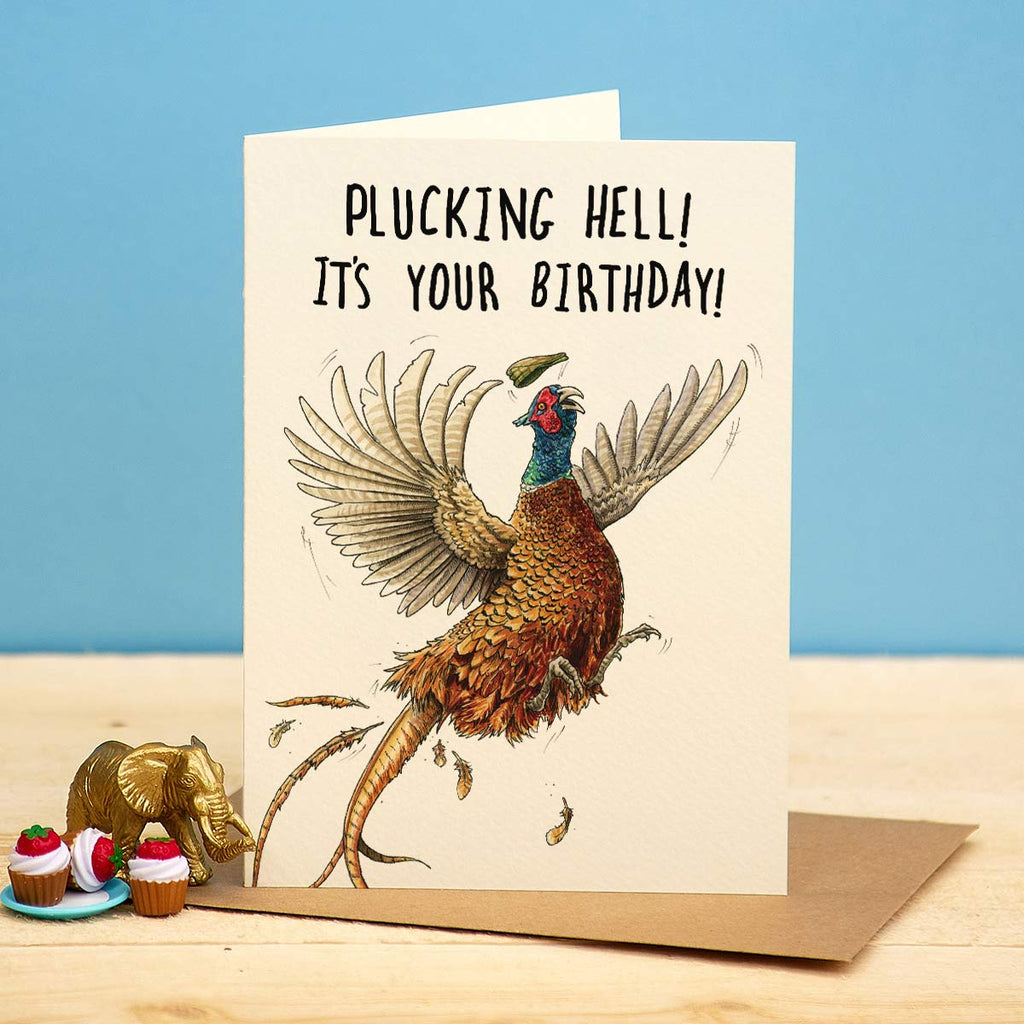 Birthday card with a pheasant illustration and humorous text on a blue background