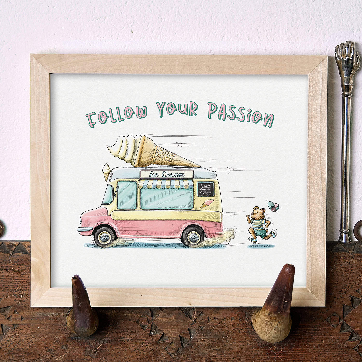 Illustration of an ice cream truck with a bear and text 'Follow Your Passion' on a wooden surface.