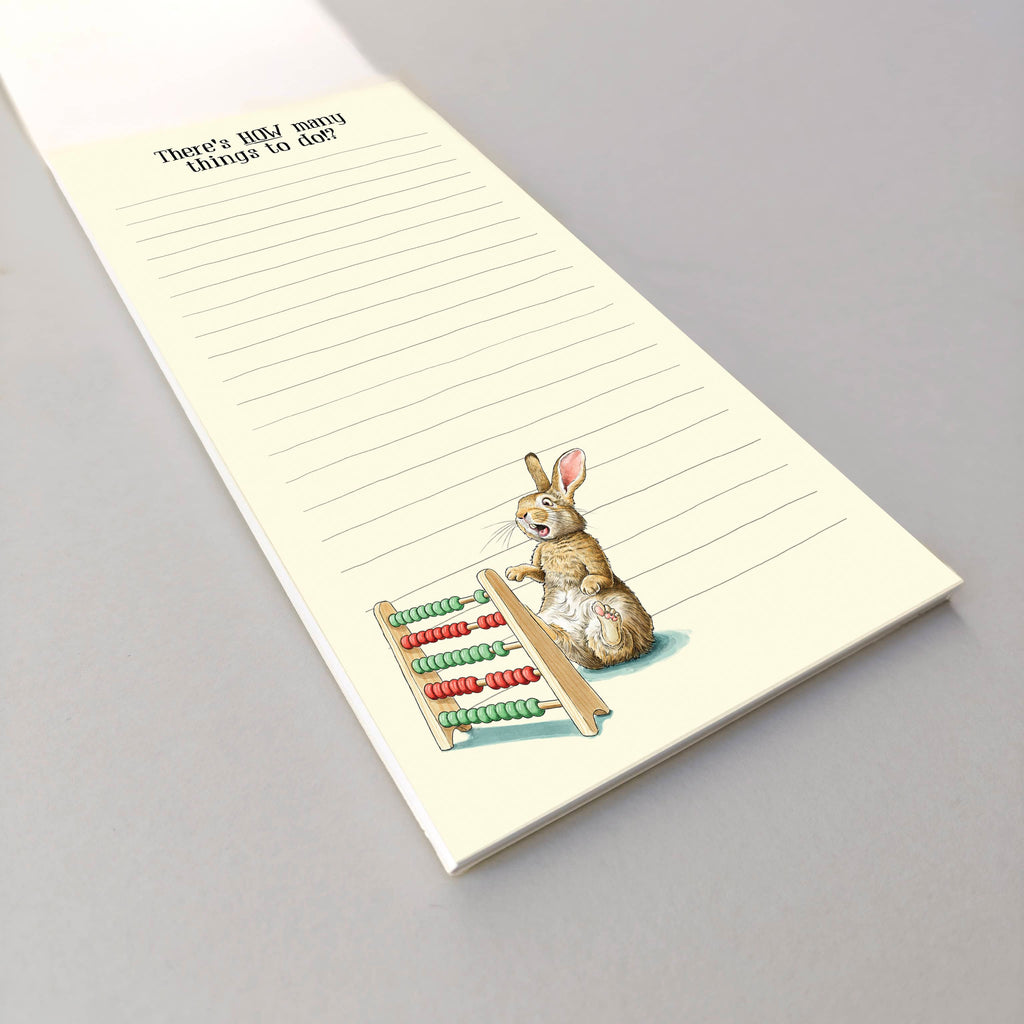 Notepad with a rabbit and abacus illustration on a gray background