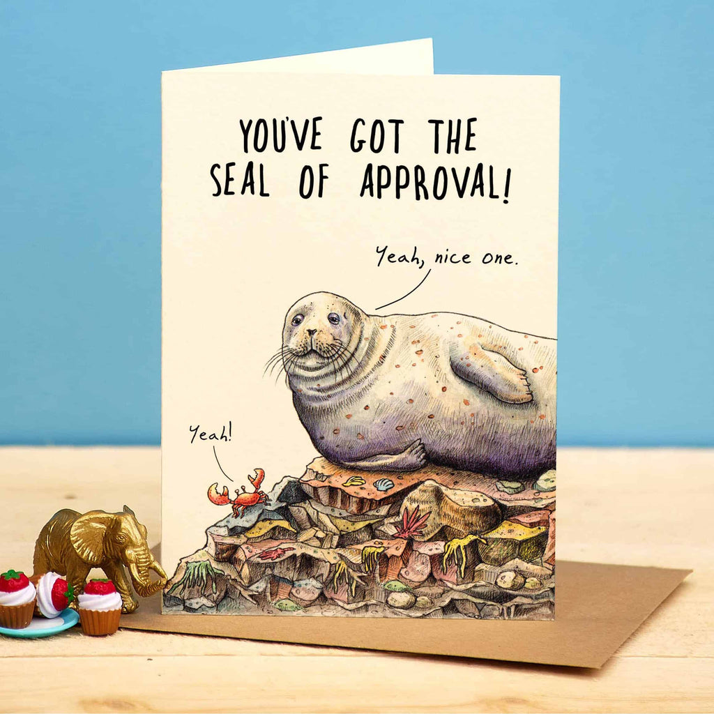 Card with a seal illustration and humorous text on a blue background