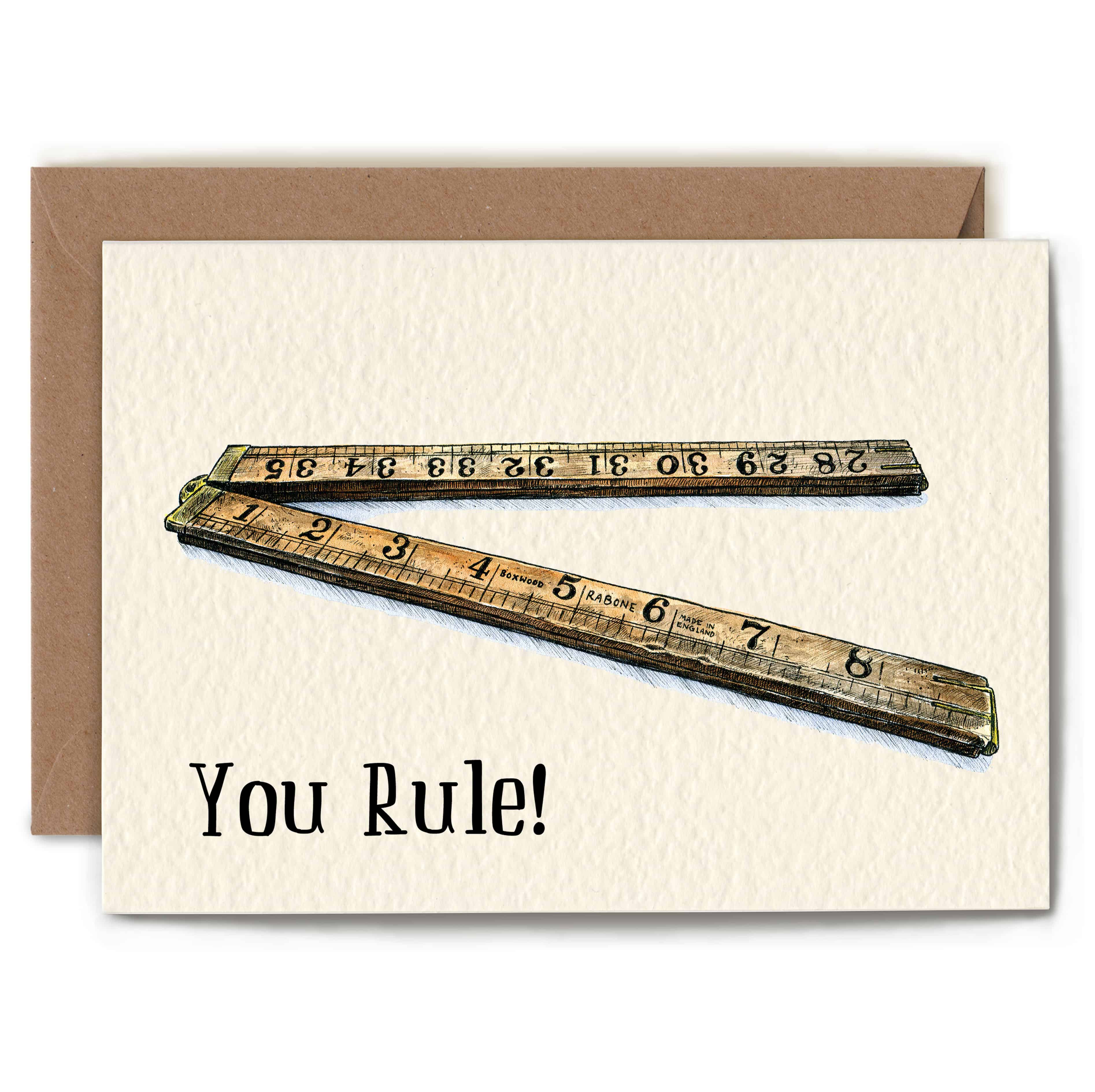 Greeting card with two vintage rulers and 'You Rule!' text on a textured background
