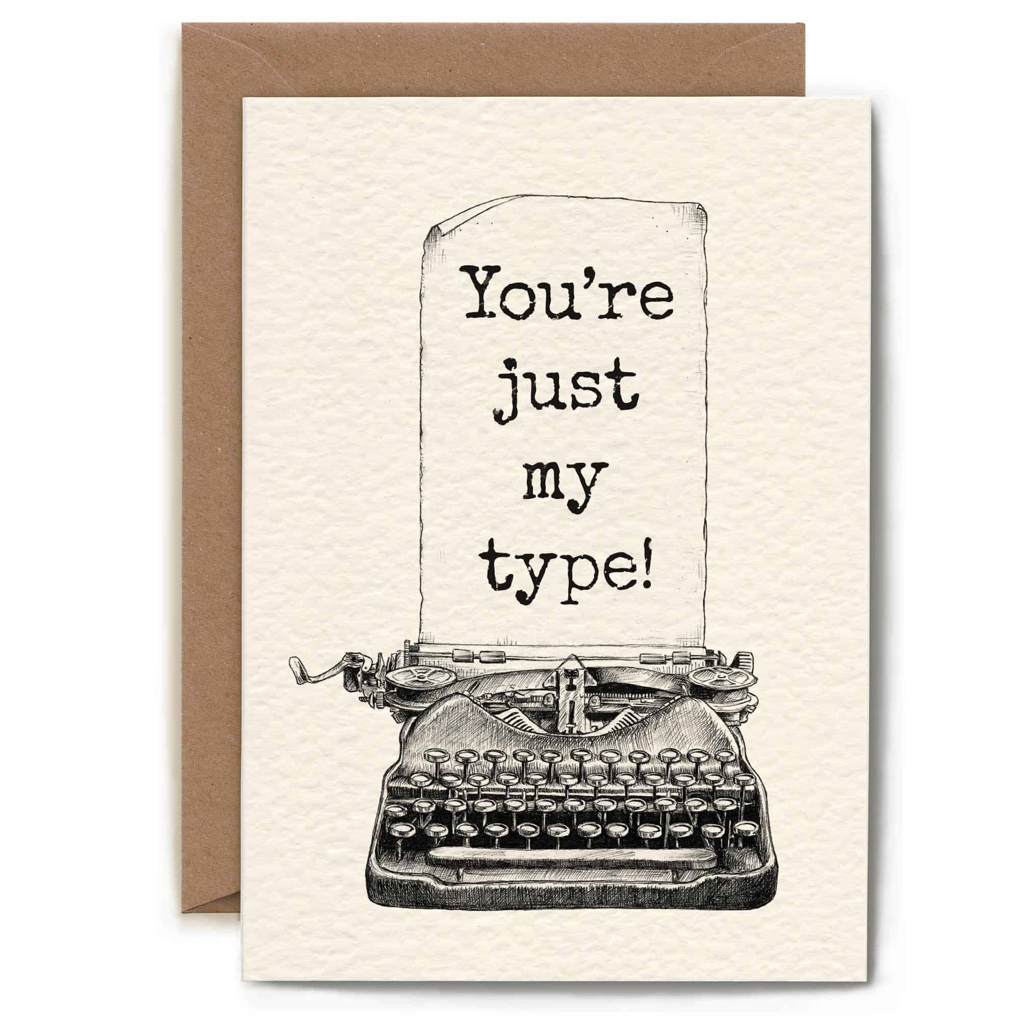 Greeting card with typewriter illustration and text 'You're just my type!' on a white background.