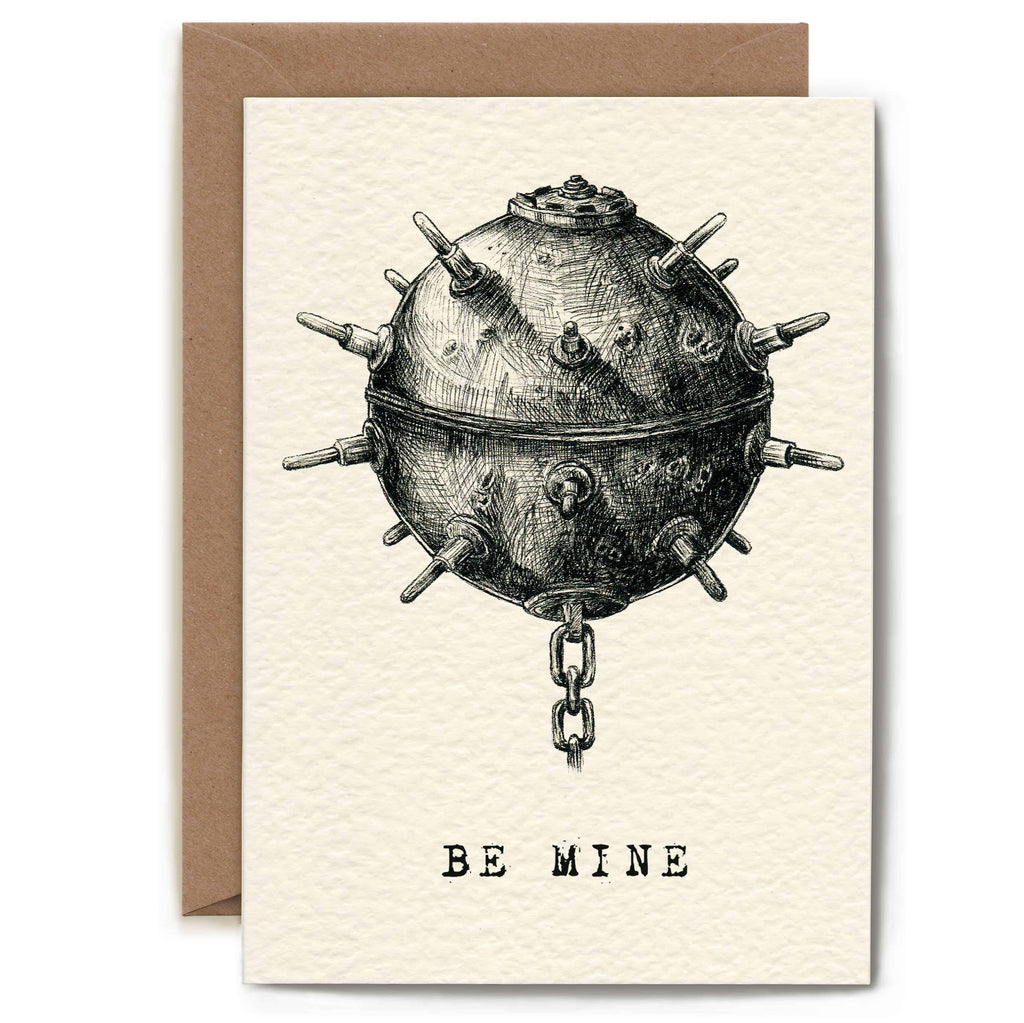 Greeting card with a vintage-style illustration of a spherical device with spikes and the text 'Be Mine' on a beige background.