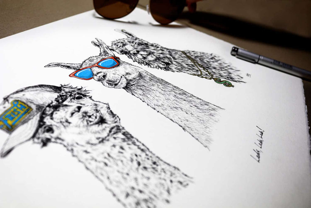 Print of three black and white llamas wearing sunglasses, a cap and a gold chain on a white background