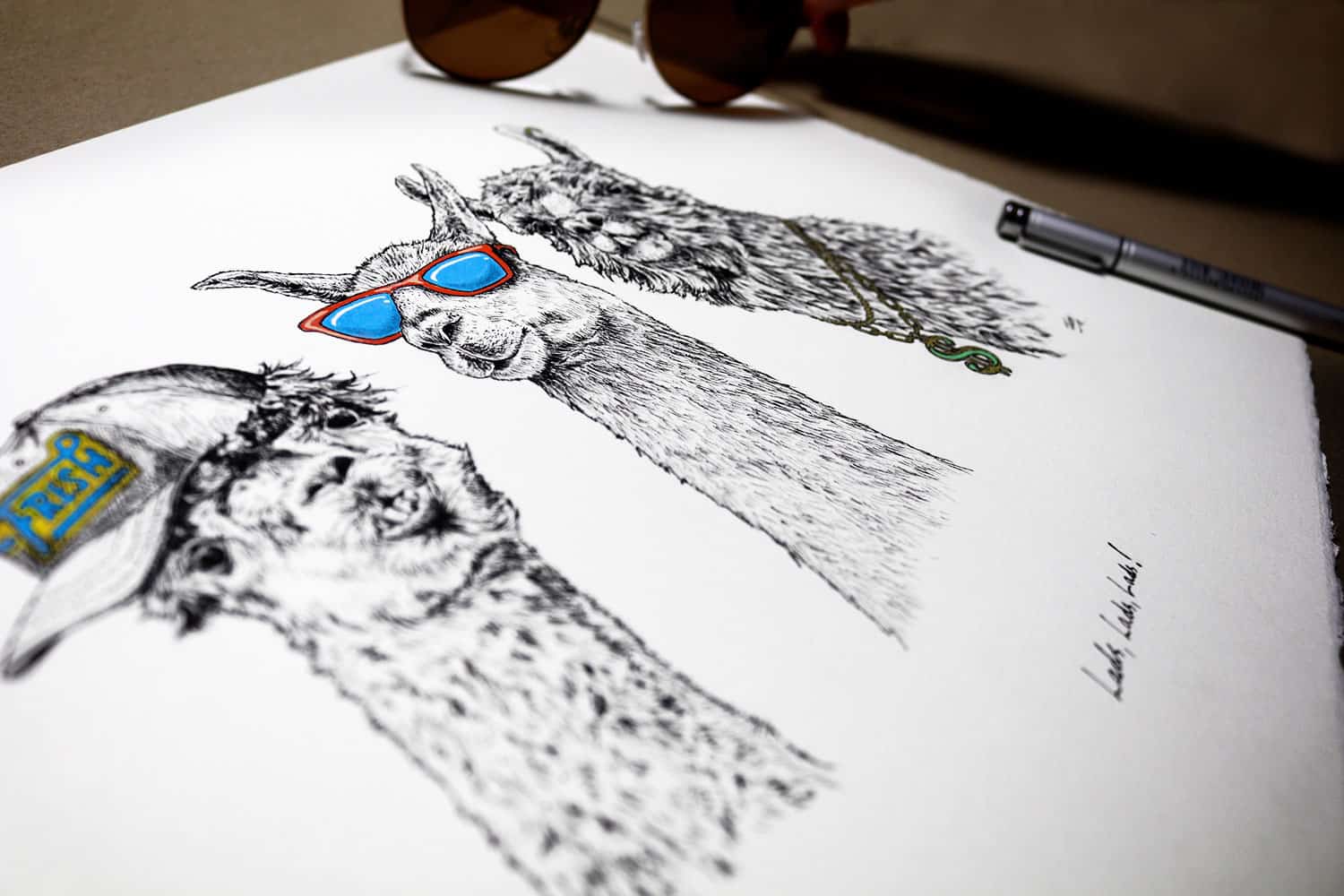 Print of three black and white llamas wearing sunglasses, a cap and a gold chain on a white background