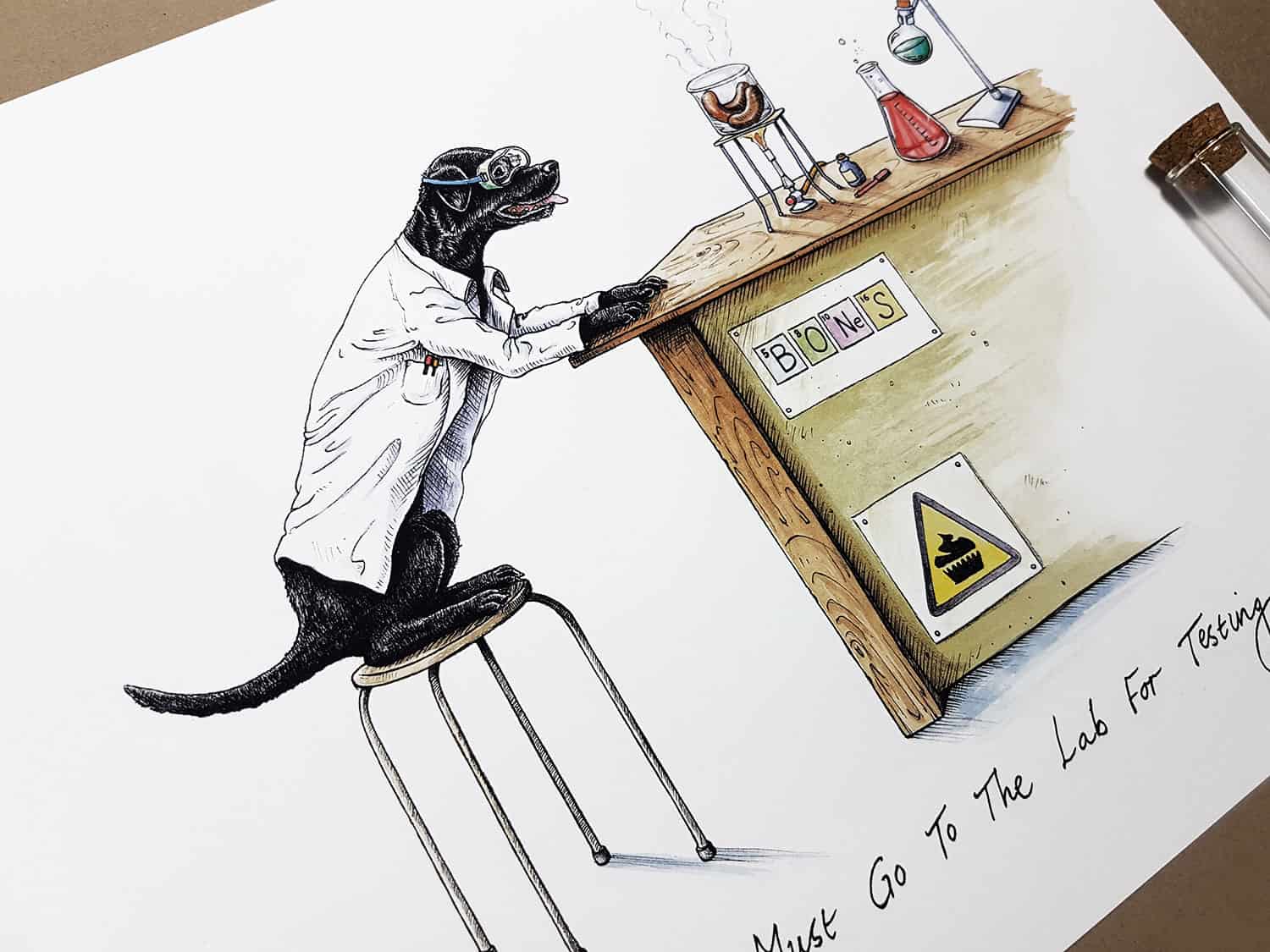 Print of a black labrador wearing a white Lab coat sitting at a desk in a science lab cooking sausages over a Bunsen burner