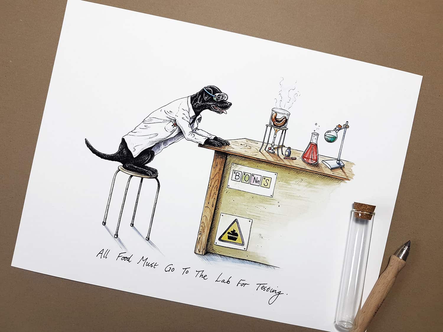 Print of a black labrador wearing a white Lab coat sitting at a desk in a science lab cooking sausages over a Bunsen burner