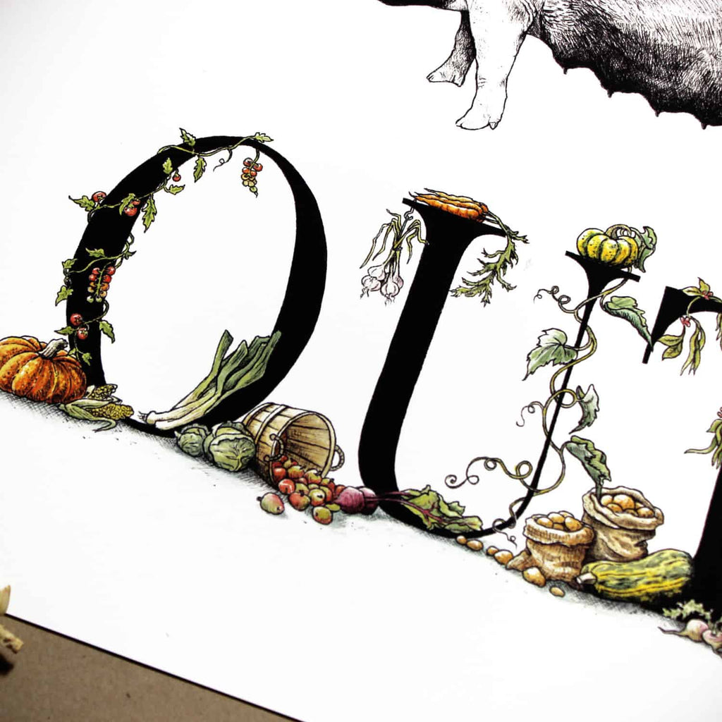 Print of detailed black lettering with vegetables growing around the letters on a white background