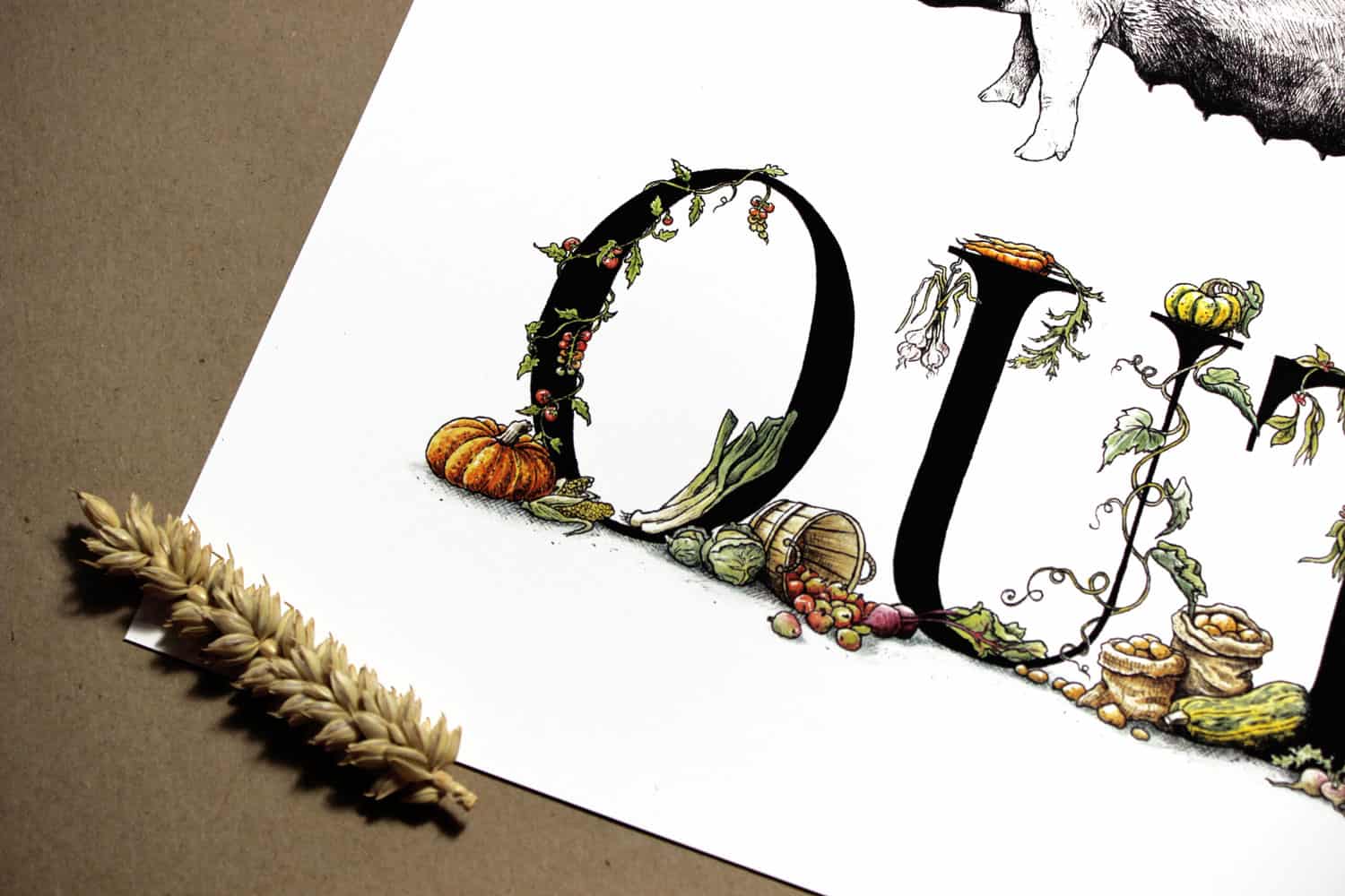 Print of detailed black lettering with vegetables growing around the letters on a white background