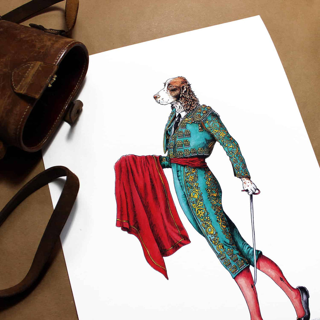 Print of an elegant liver and white Spaniel wearing a traditional Spanish matador outfit on white paper