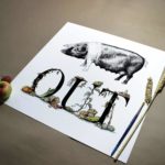 Print of a saddleback pig above bold black lettering decorated with vegetables growing around and beside the letters