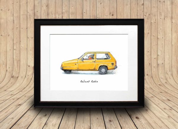 A print of a robin wearing a woolly hat driving a yellow reliant robin car in a black frame on a wooden curved background