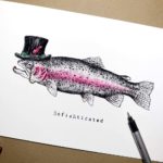 Print of a fish wearing a top hat with a monocle on white paper on a brown background