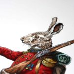 Head of a Hare wearing a red British military uniform holding a musket over its shoulder on white paper